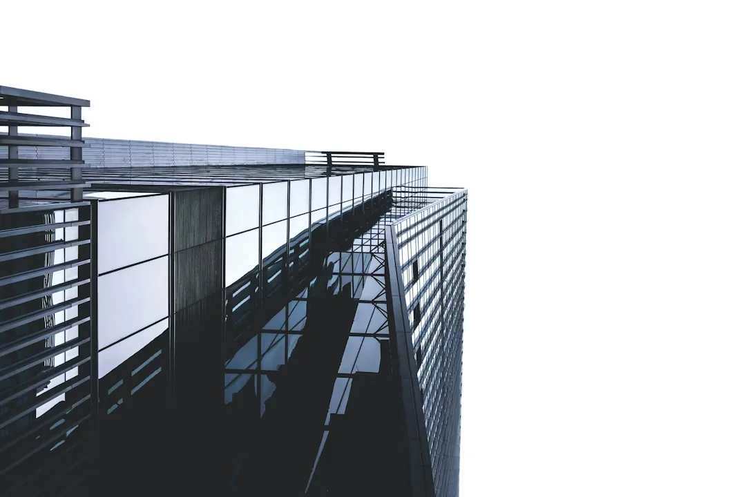 Modern glass office building exterior with steel balconies
